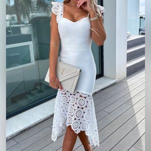 White lace dress. Never worn, new with the tags. Size small.